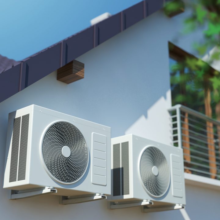Air conditioning compressor units at the outdoor wall of a house